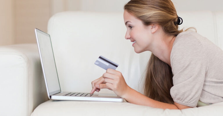 Side,View,Of,Casual,Woman,Doing,Online,Shopping,Through,Laptop